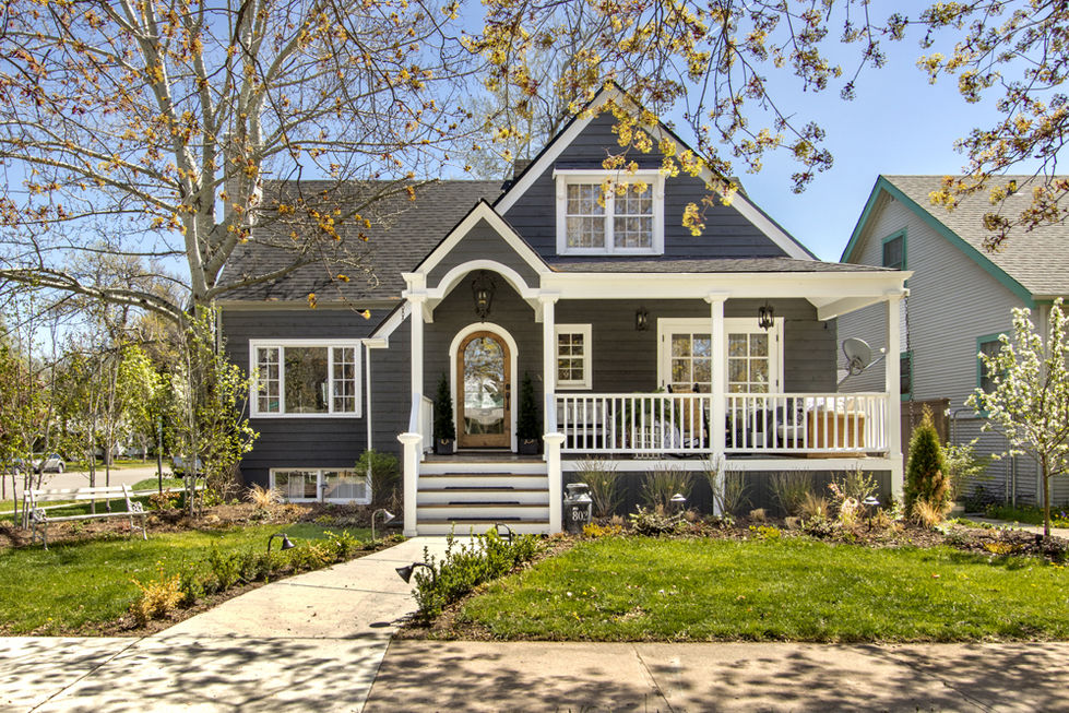 traditional house with arched porch gable