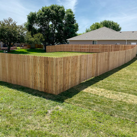 Large dog ear privacy fence.