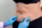 Belly with purple marking on it being evaluated by a medical provider.
