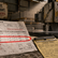 Dry dock turbine hall with clipped paperwork and a red chalk mark, showing how a supplier invoice audit uncovers hidden margin loss.
