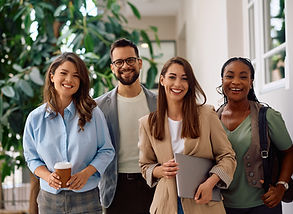 Happy multiracial group of creative business people in the office looking at camera..jpg