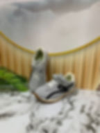 Grey children's sneakers with black design and velcro