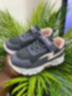 Dark grey children's sneakers with pink accents