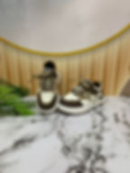 Brown and white baby sneakers