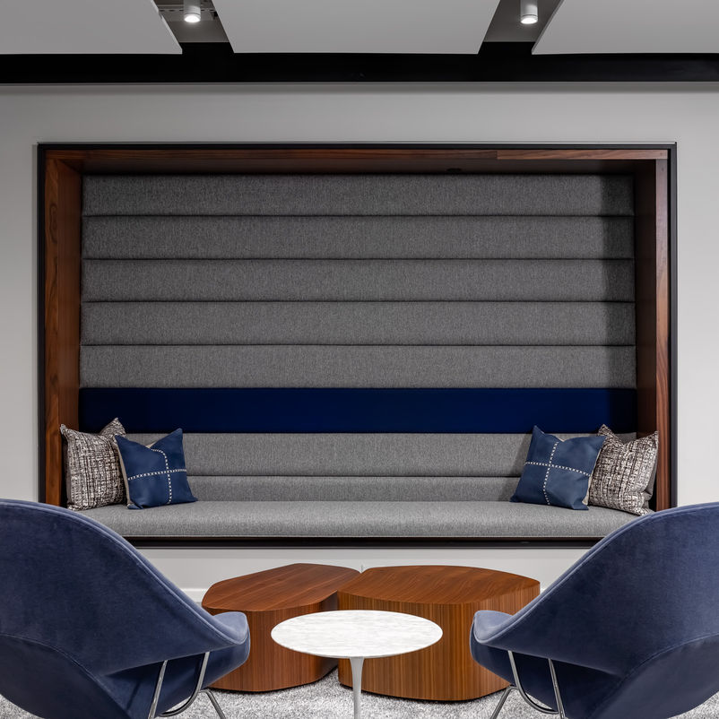 Reception waiting area, built-in booth seating and Knoll Womb Chairs with Saarinen Side Table and organic coffee table