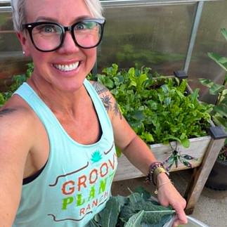 The author with her basket of homegrown kale and lettuce