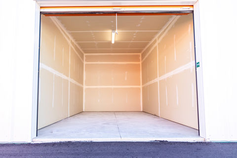 Empty storage shed with a light on the ceiling