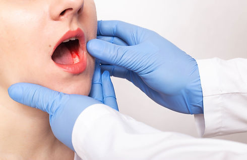 Dentist doctor examines the bite of the jaw of a girl