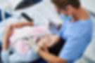 Dentist in doing teeth cleaning for young lady