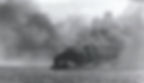 HMS Glorious, seen listing and on fire shortly before she sank.