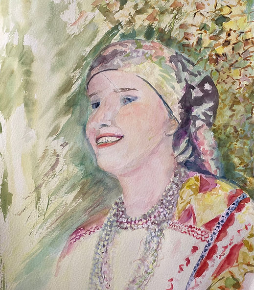 « Irina » rend hommage à la mémoire et aux traditions à travers le portrait lumineux d’une femme en costume folklorique. Un médaillon perlé encadre son visage souriant, symbole d’ancrage et de transmission.