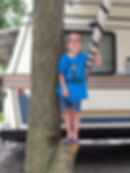 July 20, 2013: Brayden in front of the camper!