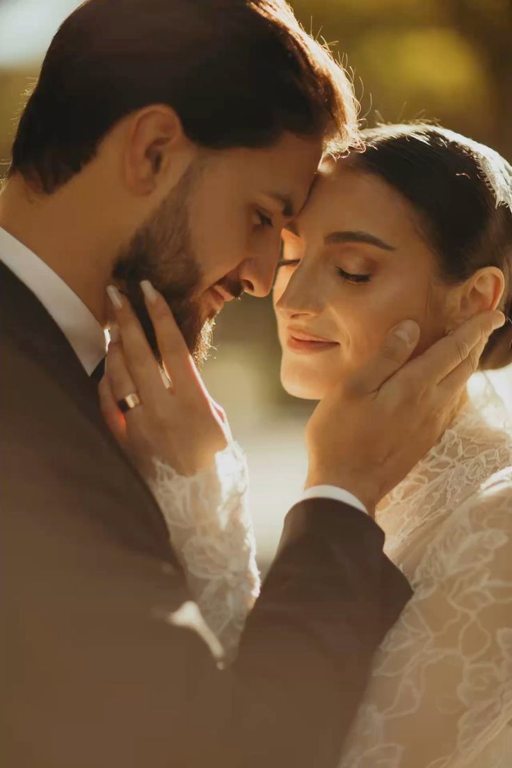 Bride and groom with foreheads touching
