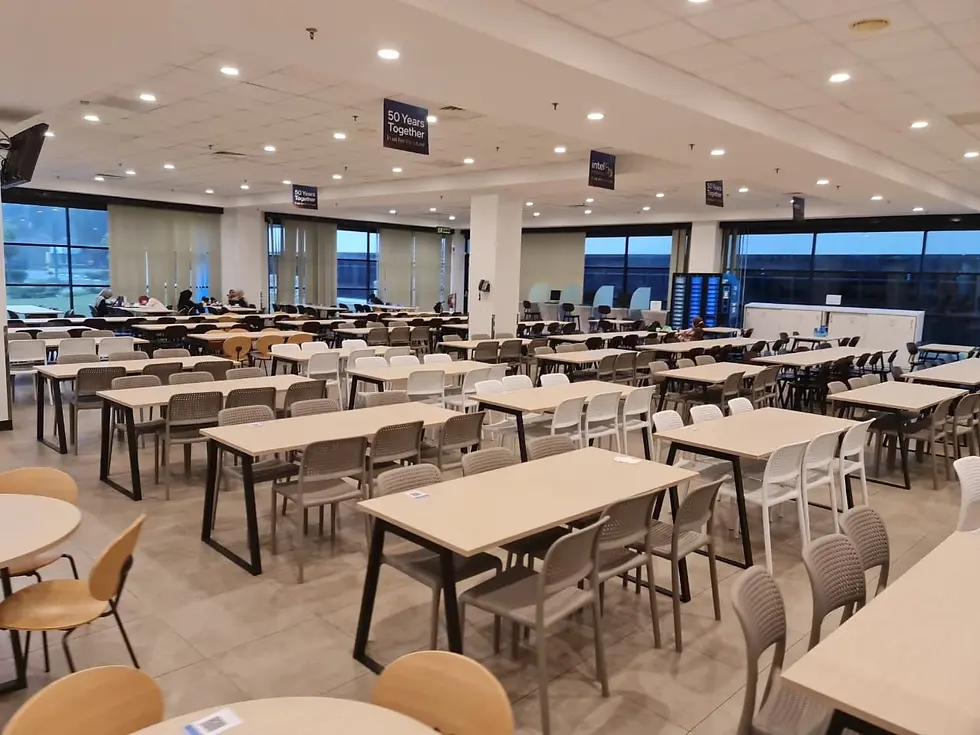 Completed canteen furniture setup at Intel Malaysia with tables and chairs fully arranged, ready for staff use