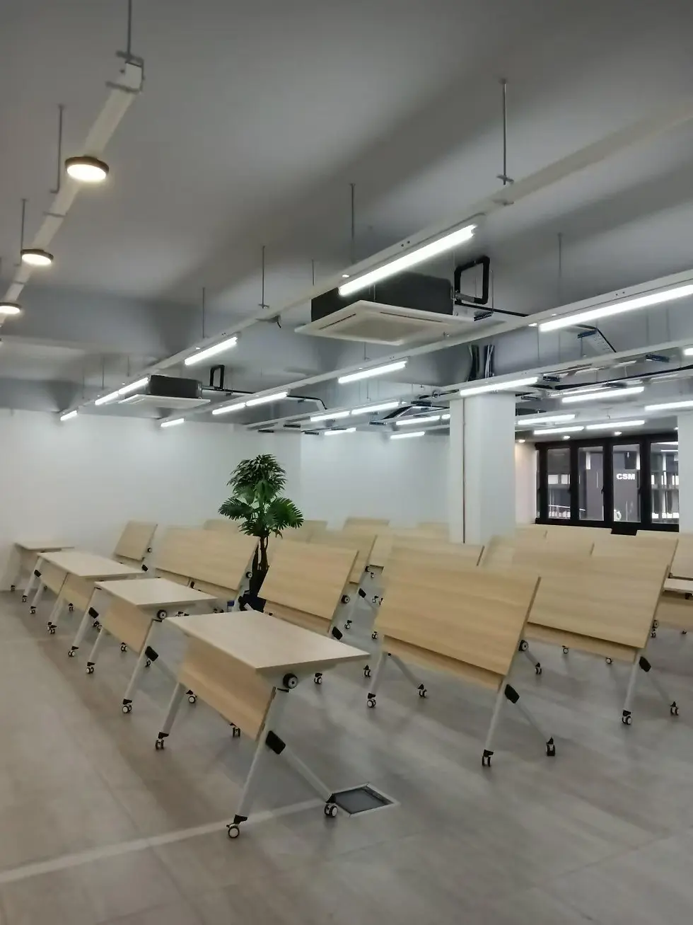 Alternate angle of the completed meeting room setup in Bukit Mertajam showing central table and seating layout for 25 people