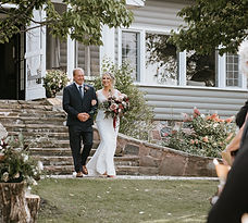 Father and daughter walk down the aisle