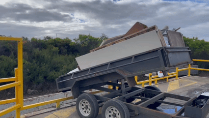 tipping trailer unloading hard rubbish at a waste transfer station