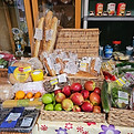 Different fruit, bread and vegetables on the sharing table