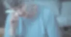 sad elderly woman wiping tears with a small towel on a rainy day