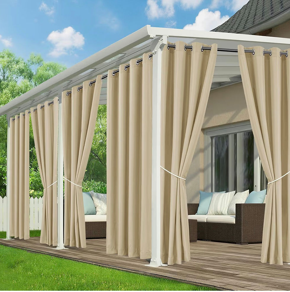 Beige curtains hang around a white backyard pergola with wicker sofa and cushions on a sunny patio, calm outdoor scene
