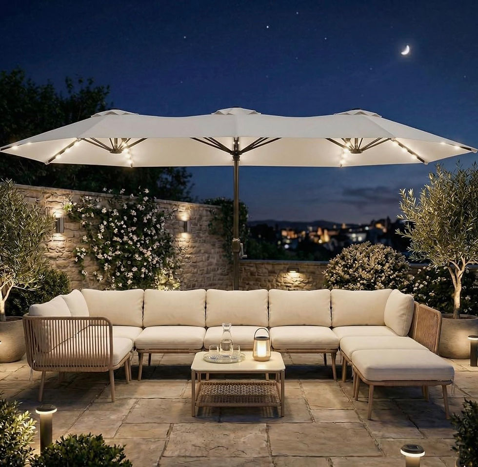 Elegant outdoor patio lounge at night with cream sectional, lit umbrella, coffee table, stone wall, plants, and crescent moon overhead