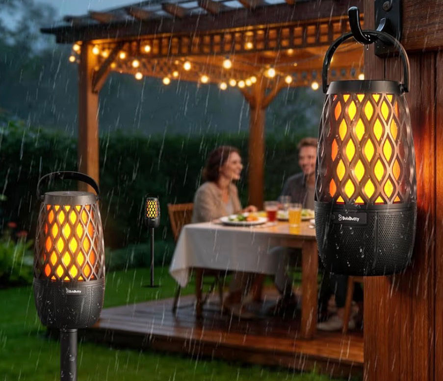 Rainy backyard patio dinner under a pergola, with a couple talking as glowing lanterns and string lights create a cozy mood.