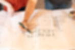 Closeup of blueprints for custom home design by The Kanstrukt Group