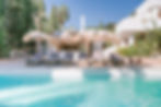 Elegant pool terrace with luxury sun loungers at a private Ibiza villa.