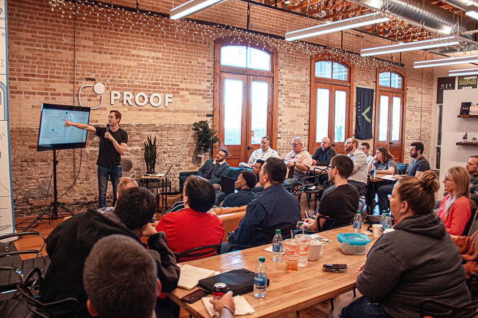 A presenter passionately pitches a startup idea to an engaged audience at a vibrant coworking space.