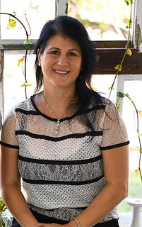 Photo of Jessica, Founder of Wildcraft Ayurveda sitting outside