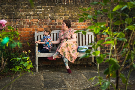 Mother and her son admiring nature in the courtyard.