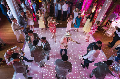 Shot from above showing the dancefloor and wedding guests dancing