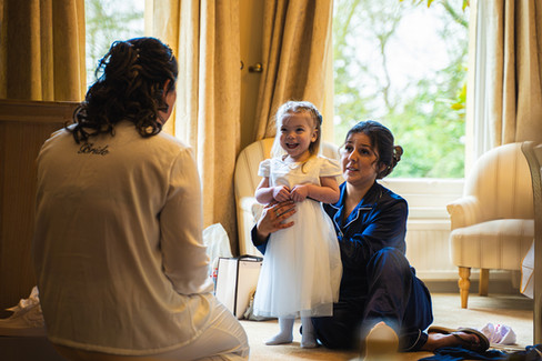 flower girl during bridal preparations at Woodland Manor Bedford wedding venue