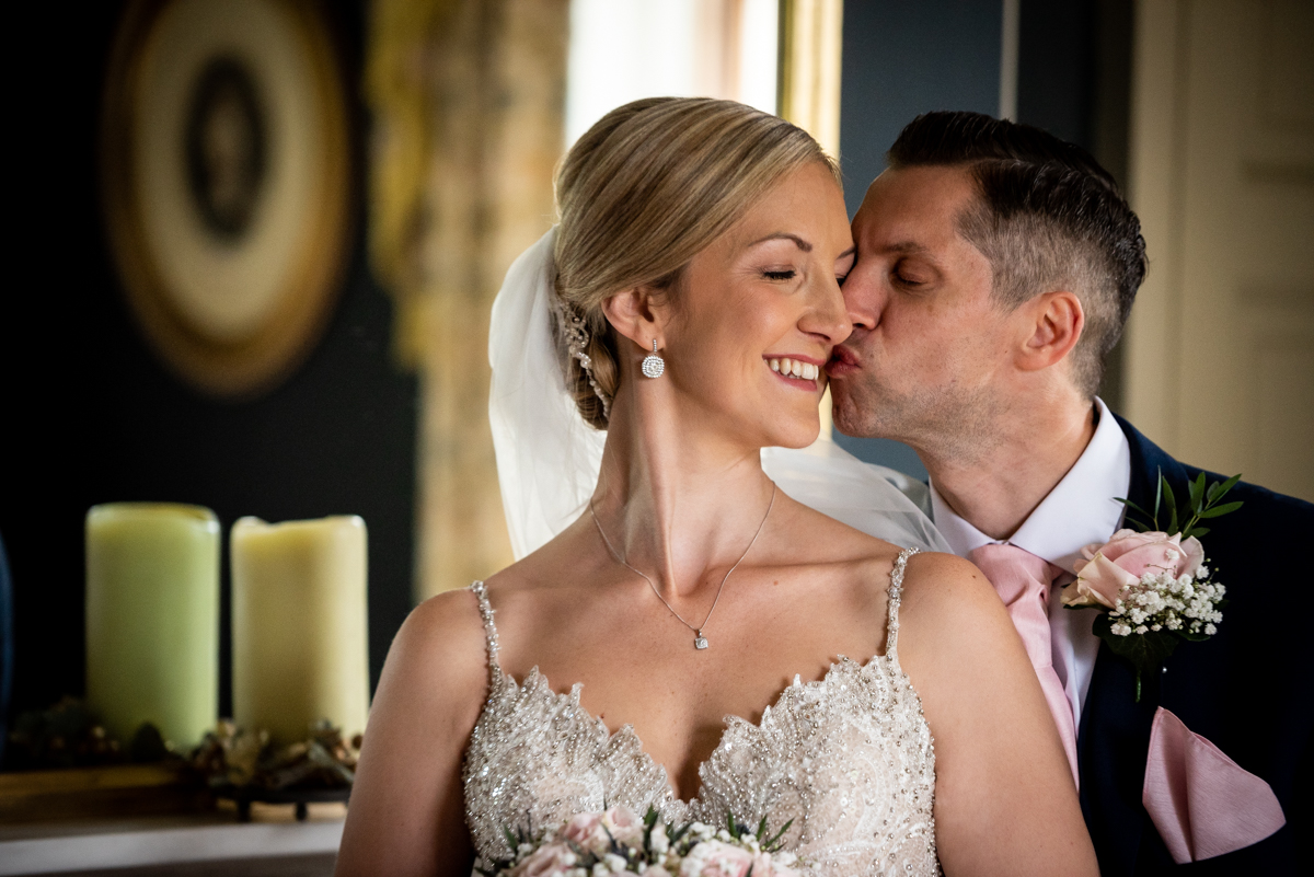Groom kissing the bride