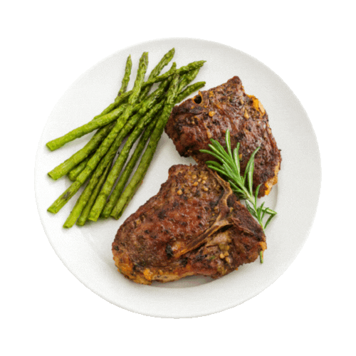 Chef monitoring the kambing golek spit over an open flame