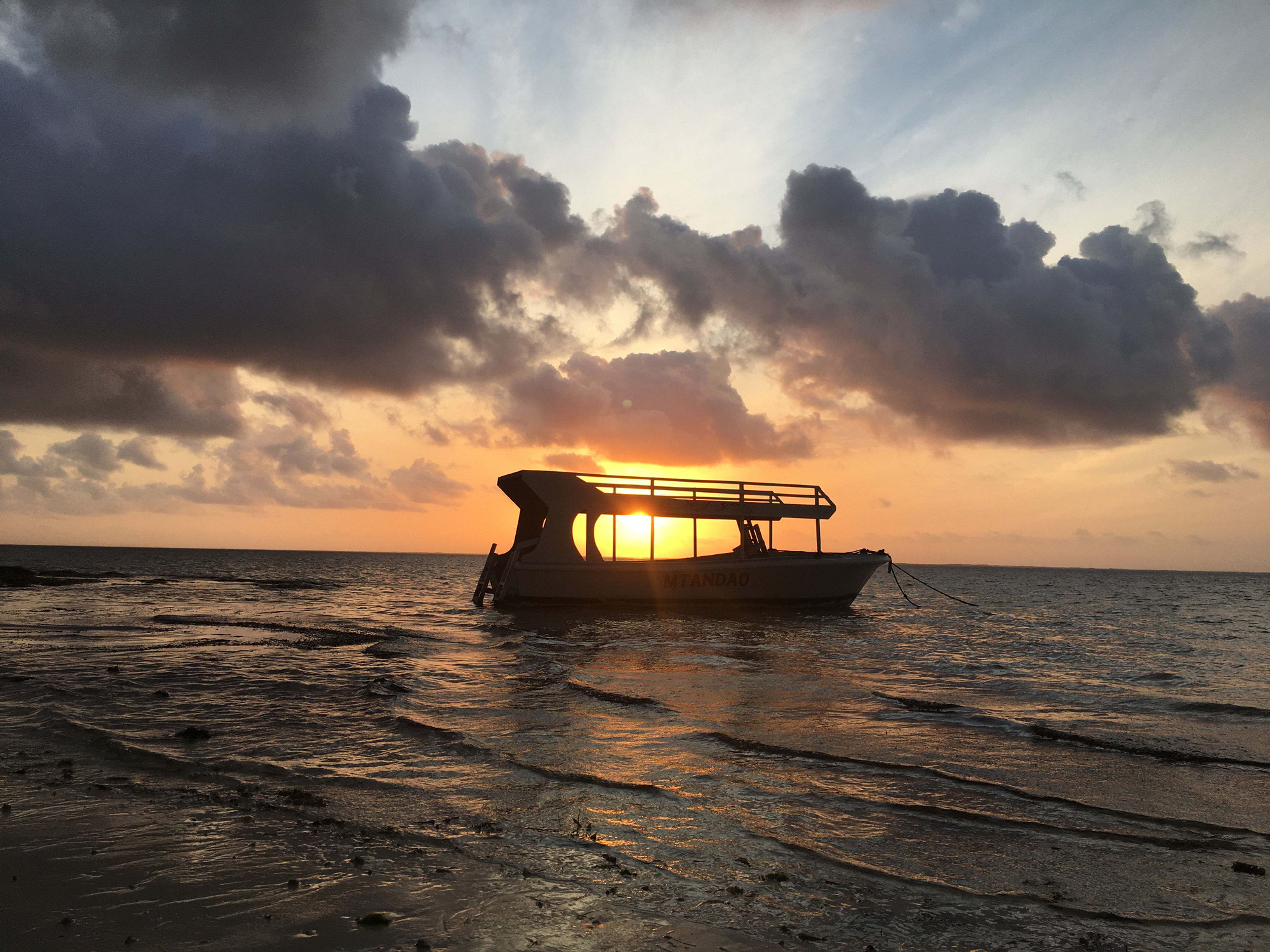 A boat at sunrise in Mombasa beach