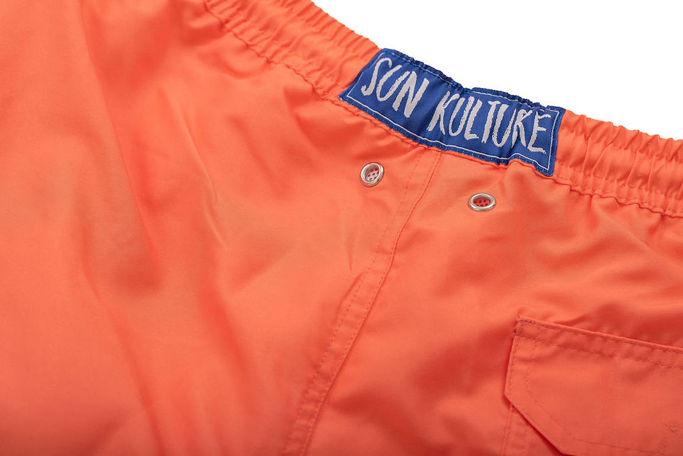 Thumbnail: Close Up Shot of the Living Coral Short/ Swimtrunk Eco Short Sun Kulture Logo and silver eyelets