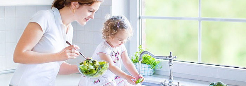 toddler girl_mom washing veggies.jpg