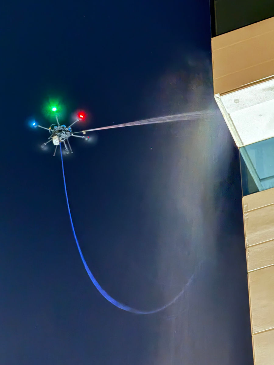 After-hours drone facade cleaning