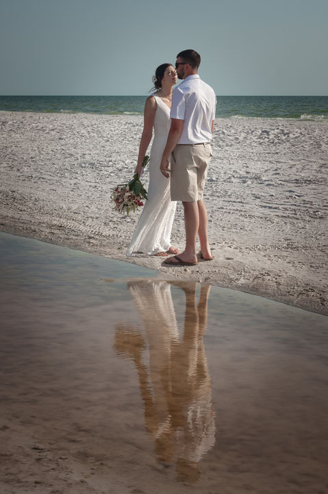 Golden Hour wedding couple reflections in the water. Ft. Myers Beach.