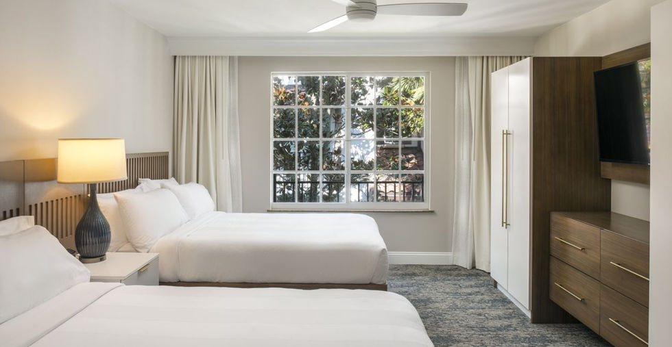 Two beds in bright hotel room.  Marriott's Lakeshore Reserve Hotel, Orlando, Florida.
