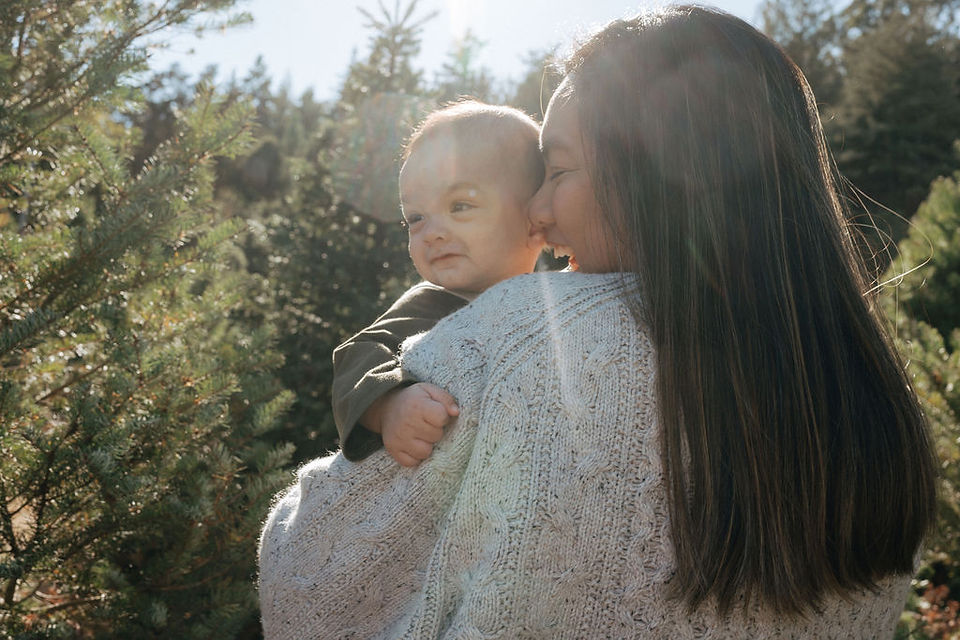 mother and son at christmas tree farm