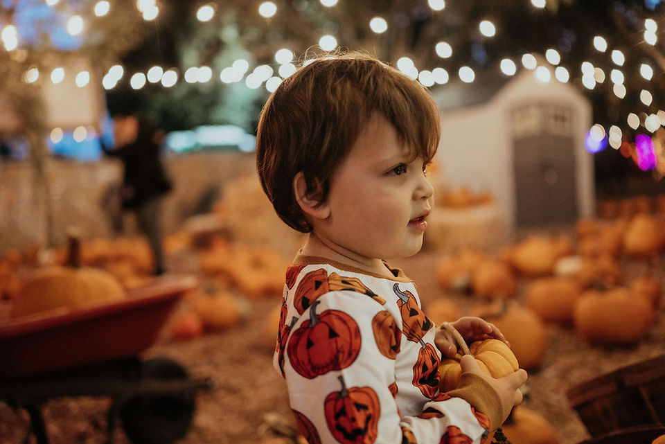 boy wearing pumpkin shirt at Moreland pumpkin patch