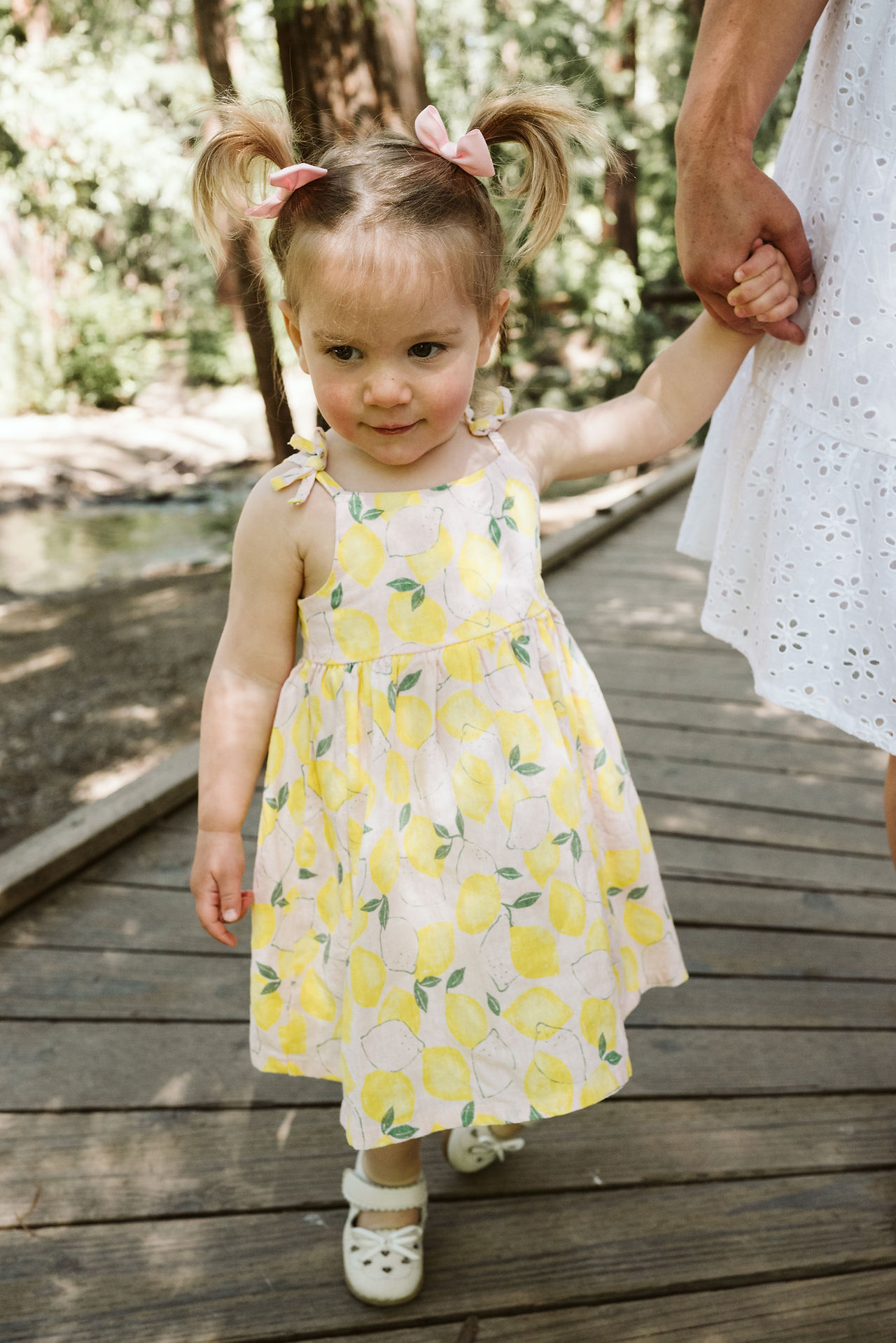 girl walking with mom
