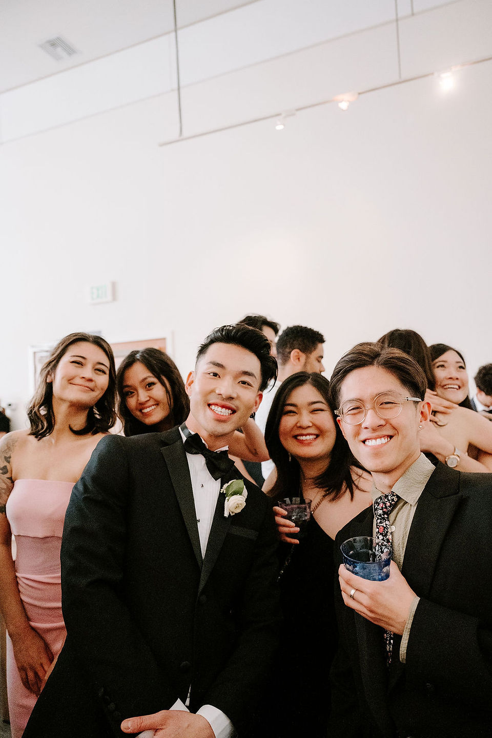 photo of a group of wedding guests and groom at the foreign cinema