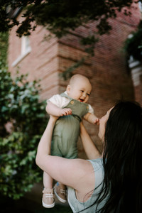 mom holding baby up in filoli gardens