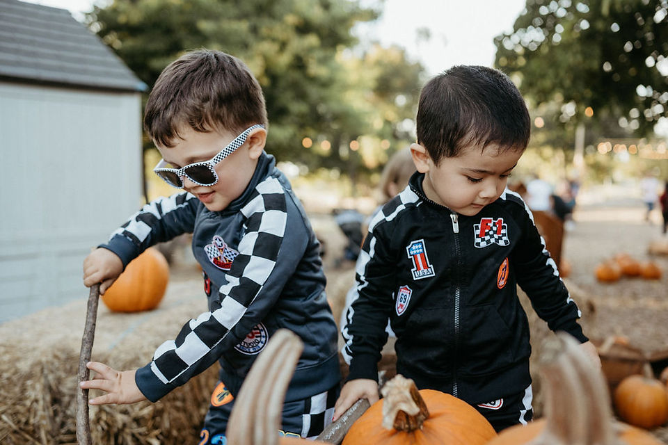two boys in race car drivers costume