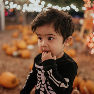 boy wearing skeleton costume at Moreland pumpkin patch