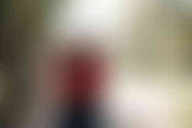 a couple holding hugging each other joyfully at Guadalupe oak Gove