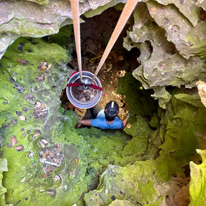Eleonore at the bottom of a private ranch pit, loading buckets while Drew digs below.